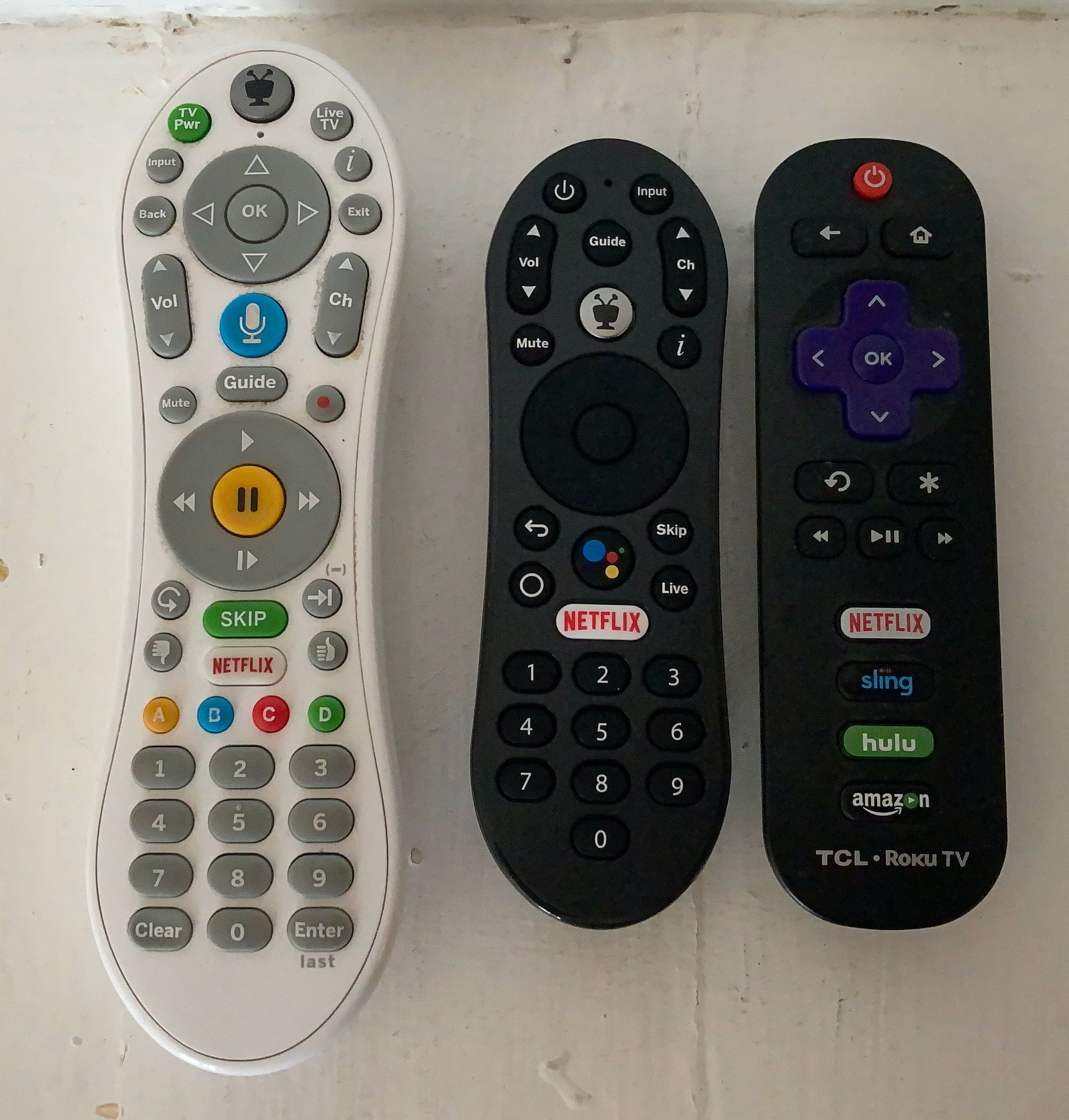 Photo showing a traditional Tivo remote, the Tivo Stream 4K remote, and a Roku remote